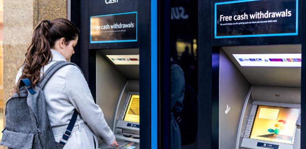 Woman drawing a cash advance using a credit card